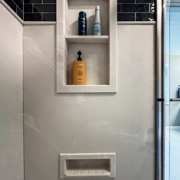 Primary Bathroom with Blue-Gray Vanity and Deep Blue Tiled Feature Wall