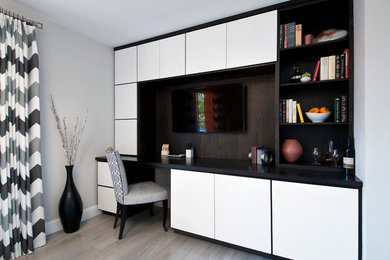Inspiration for a mid-sized contemporary built-in desk light wood floor study room remodel in San Francisco with gray walls
