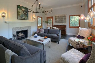 Example of a mid-sized classic enclosed dark wood floor living room design in New York with white walls and a standard fireplace