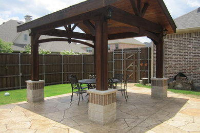 Mid-sized traditional backyard patio in Dallas with an outdoor kitchen and a gazebo/cabana.