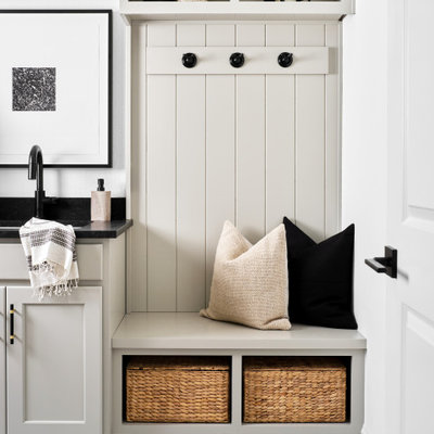 Dedicated laundry room - mid-sized transitional galley ceramic tile and multicolored floor dedicated laundry room idea in Austin with an undermount sink, shaker cabinets, gray cabinets, granite countertops, white walls, a side-by-side washer/dryer and black countertops