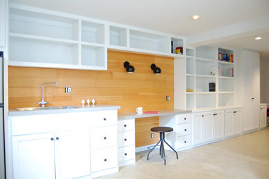 Arts and crafts concrete floor basement photo in Portland