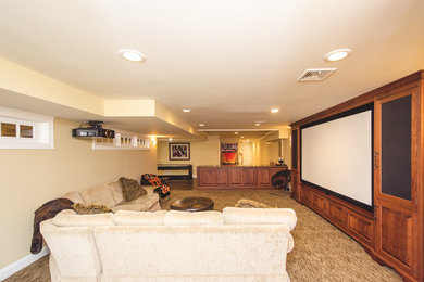 Home theater - contemporary home theater idea in New York