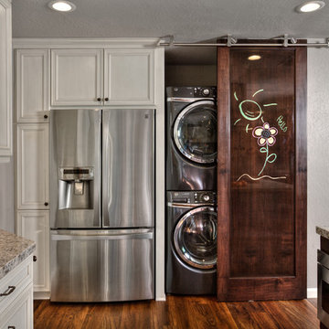 Ceiling hung barn door hardware and door.
