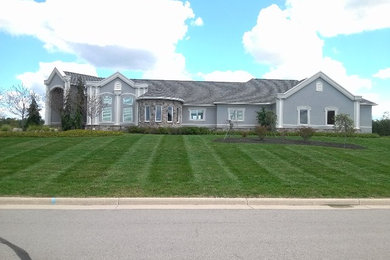 Inspiration for a large traditional full sun front yard landscaping in Other for summer.