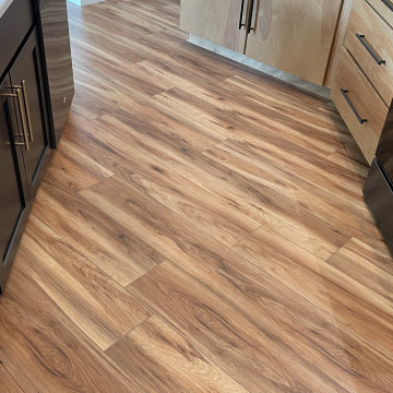 Angled Kitchen Design with Slab Style Cabinets in Pecan Stain