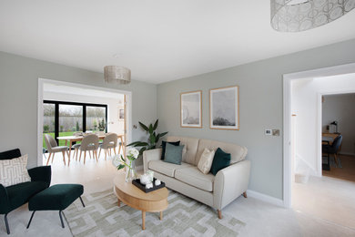 Design ideas for a large contemporary formal enclosed living room in Other with green walls, carpet, no fireplace and beige floors.