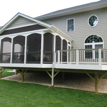 Screen porch and deck with Wolf Amberwood decking and Trex Transcends railing
