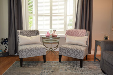 Example of a mid-sized transitional enclosed living room design in Toronto with beige walls