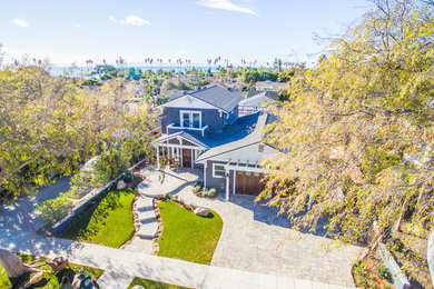 Mid-sized arts and crafts gray two-story wood exterior home photo in Santa Barbara with a shingle roof