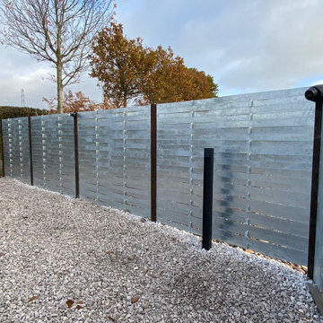 Galvanised woven steel fence panels