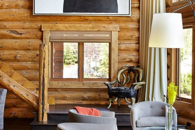 Example of a mountain style open concept dark wood floor living room design in Denver