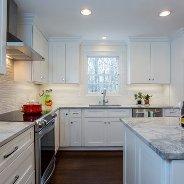 Bright White Kitchen Remodel with Quartz Island and Hardwood Floors
