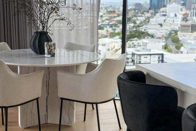 Inspiration for a mid-sized contemporary open plan dining in Brisbane with white walls and light hardwood floors.