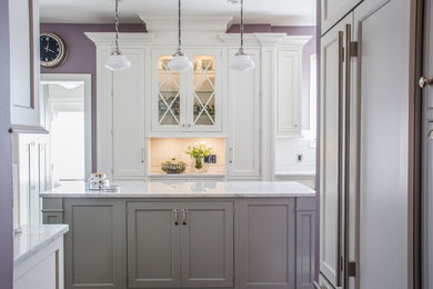 Example of a mid-sized classic u-shaped multicolored floor enclosed kitchen design in Cleveland with shaker cabinets, white cabinets, granite countertops, white backsplash, subway tile backsplash, black appliances and an island