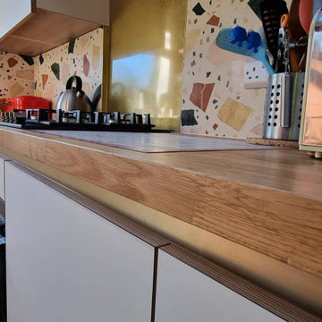 White matt handleless plywood Fenix NTM kitchen.