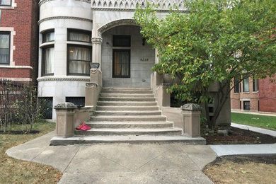 Inspiration for a large transitional partial sun front yard stone garden path in Chicago.