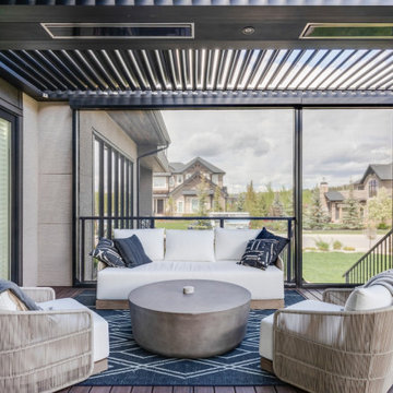 Adjustable StruXure Pergola Featuring Outdoor Kitchen With Screens & Heaters