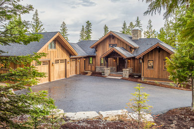 Example of a large minimalist brown two-story wood exterior home design in Other