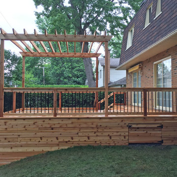 Western Red Cedar Deck with Cedar Pergola & Stone Patio & Stone Fireplace