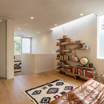Relaxed Living Area with Built-In Shelving and Natural Light