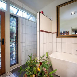 Breezway louvres in the bathroom next to door help ventilate small spaces - Windows