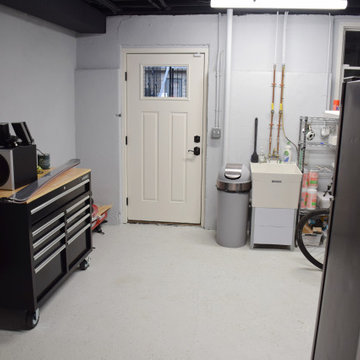 Utility room with epoxy floors and black ceiling