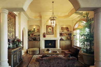Example of an island style living room design in Other