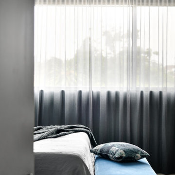 Bed end ottoman and sheer curtains