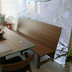 Walnut Dining Bench in front of back-lit stone panel - Products
