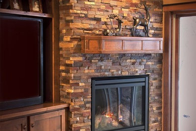 Inspiration for a timeless family room remodel in Miami with a standard fireplace and a stone fireplace
