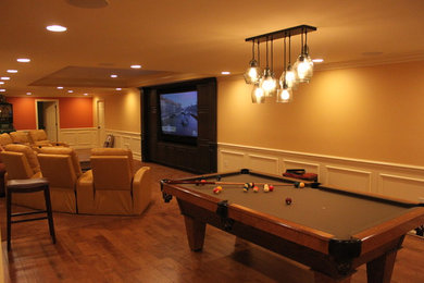 Large elegant underground carpeted and beige floor basement photo in Detroit with white walls