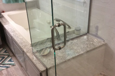 Example of a mid-sized transitional master porcelain tile pebble tile floor bathroom design in Boston