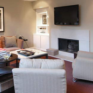This is an example of a large contemporary basement in Boston with beige walls, carpet, a standard fireplace, a tiled fireplace surround and red floors.