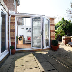 White Conservatory with PVCu Bi-Fold Doors - Products
