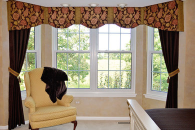 Inspiration for a timeless master carpeted bedroom remodel in Chicago with beige walls
