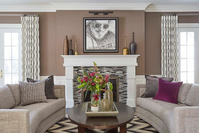 Inspiration for a mid-sized transitional formal enclosed living room in Chicago with grey walls, light hardwood floors, a standard fireplace, a tile fireplace surround, no tv and beige floor.
