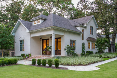 Inspiration for a timeless white two-story brick gable roof remodel in Other