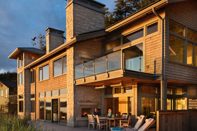 Example of a beach style home design design in Seattle