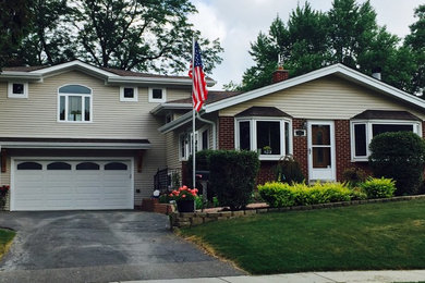 Large traditional two-story exterior home idea in Chicago