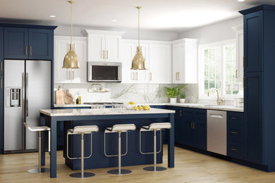 Example of a mid-sized minimalist l-shaped light wood floor and brown floor open concept kitchen design with an undermount sink, shaker cabinets, blue cabinets, quartz countertops, white backsplash, quartz backsplash, stainless steel appliances, an island and white countertops