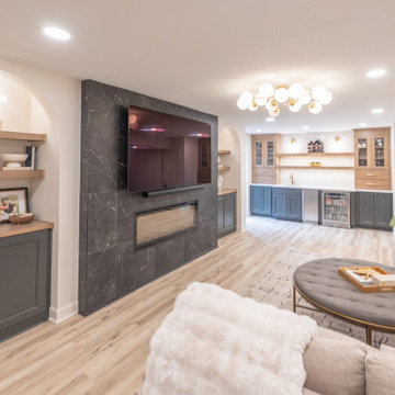 Warm & Inviting Basement Retreat with Custom Bar + Entertainment Center