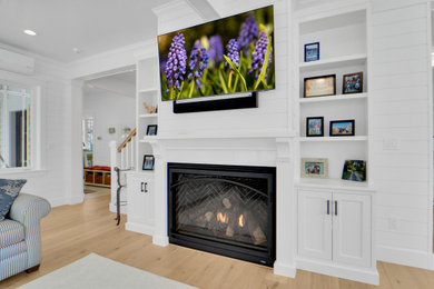 Example of a transitional living room design in New York