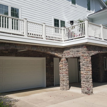 Estate Home with Covered Porch and Water Diversion System for Dry Space Below