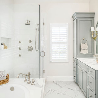 Inspiration for a transitional master white tile and porcelain tile porcelain tile, white floor and double-sink corner shower remodel in Charlotte with shaker cabinets, gray cabinets, an undermount tub, an undermount sink, quartz countertops, a hinged shower door, white countertops, a niche and a built-in vanity