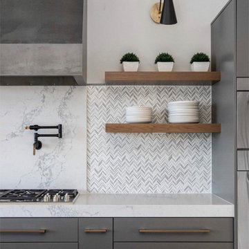 Contemporary Kitchen With Floating Shelves and Herringbone Marble Tile Backsplas