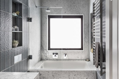 Design ideas for a modern master bathroom in San Francisco with flat-panel cabinets and marble benchtops.