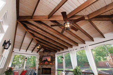 Inspiration for a transitional backyard verandah in Atlanta with a roof extension.