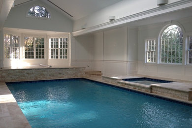 Example of a large classic indoor tile and rectangular lap hot tub design in New York