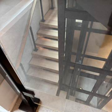 Project #136 | Modern Floating Staircase Encircling Glass Elevator